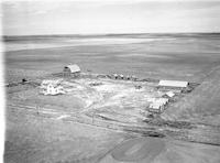 Aerial photograph of a farm in Saskatchewan (26-36-23-W3)