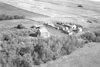 Aerial photograph of a farm near Macklin, SK (38-28-W3)
