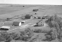 Aerial photograph of a farm near Macklin, SK (38-28-W3)