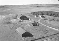 Aerial photograph of a farm near Macklin, SK (38-28-W3)