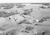 Aerial photograph of a farm near Cando, SK (39-15-W3)