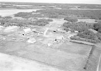 Aerial photograph of a farm near Cando, SK (39-15-W3)
