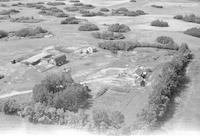 Aerial photograph of a farm near Cando, SK (39-16-W3)