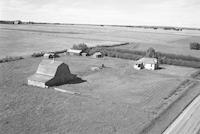 Aerial photograph of a farm near Macklin, SK (39-28-W3)