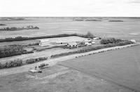 Aerial photograph of a farm near Blaine Lake, SK (13-44-6-W3)