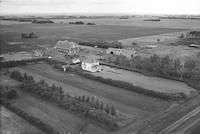 Aerial photograph of a farm near Blaine Lake, SK (16-44-6-W3)