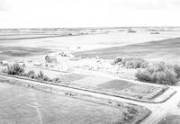 Aerial photograph of a farm near Blaine Lake, SK (44-6-W3)