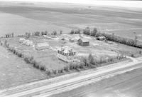 Aerial photograph of a farm near Wilkie, SK (38-21-W3)