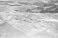 Aerial photograph of a farm near North Battleford, SK (46-17-W3)