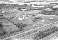 Aerial photograph of a farm near Blaine Lake, SK (45-7-W3)