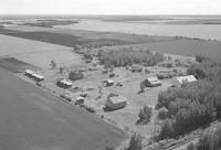 Aerial photograph of a farm near Meadow Lake, SK (60-17-W3)