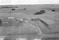 Aerial photograph of a farm near Macklin, SK (39-27-W3)