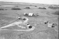 Aerial photograph of a farm near Macklin, SK (39-28-W3)