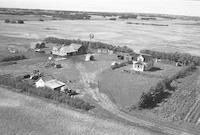 Aerial photograph of a farm near Macklin, SK (39-28-W3)