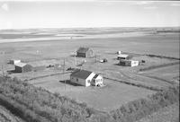 Aerial photograph of a farm near Macklin, SK (38-28-W3)