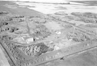 Aerial photograph of a farm near Prince, SK (2-46-17-W3)