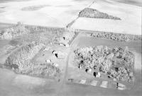 Aerial photograph of a farm near North Battleford, SK (46-17-W3)