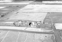 Aerial photograph of a farm near Meota, SK (46-18-W3)