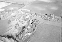 Aerial photograph of a farm near Meota, SK (45-18-W3)