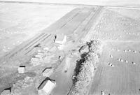 Aerial photograph of a farm near Meota, SK (46-18-W3)