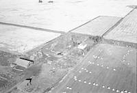 Aerial photograph of a farm near Meota, SK (46-18-W3)