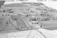 Aerial photograph of a farm near Meota, SK (47-18-W3)