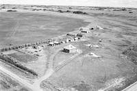 Aerial photograph of a farm near Trojan, AB (39-15-W3)