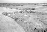 Aerial photograph of a farm near Mervin, SK (51-20-W3)