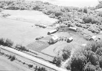 Aerial photograph of a farm near Meadow Lake, SK (60-18-W3)