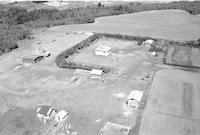 Aerial photograph of a farm near Hafford, SK (42-9-W3)