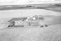 Aerial photograph of a farm near Meadow Lake, SK (59-17-W3)