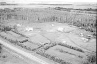 Aerial photograph of a farm near Meadow Lake, SK (60-18-W3)