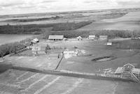 Aerial photograph of a farm near Meadow Lake, SK (59-17-W3)