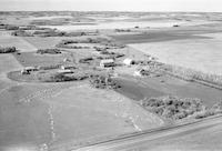 Aerial photograph of a farm near Richard, SK (44-12-W3)