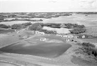 Aerial photograph of a farm near Hafford, SK (44-10-W3)